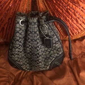 Black and gray coach bucket wristlet